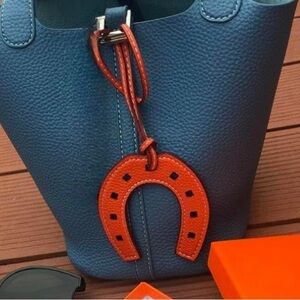 Designer luxury style Horse shoe H look bag charm in orange quiet luxury…